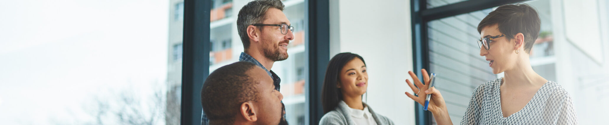 People having a discussion in a modern office setting